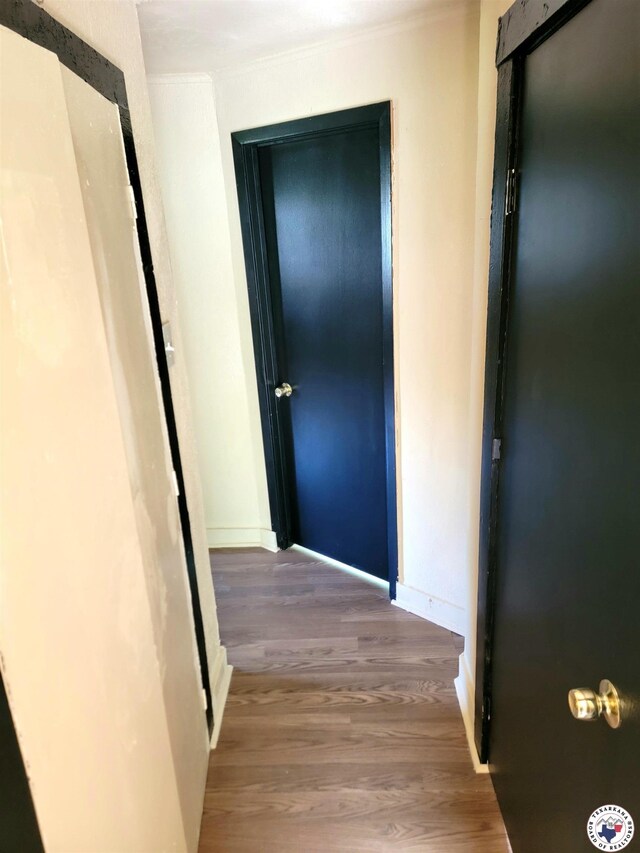 501 S Columbia St, Clarksville, TX 75426 - hall with wood finished floors and baseboards