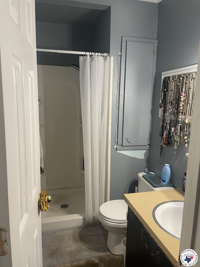 1921 E 40th St, Texarkana, AR 71854 - full bathroom with vanity, a stall shower, and tile patterned floors