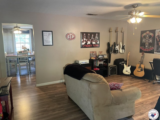 1921 E 40th St, Texarkana, AR 71854 - living room with ceiling fan, wood finished floors, and a textured ceiling
