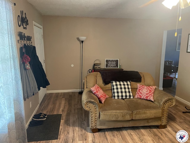 1921 E 40th St, Texarkana, AR 71854 - living area with wood finished floors and a ceiling fan