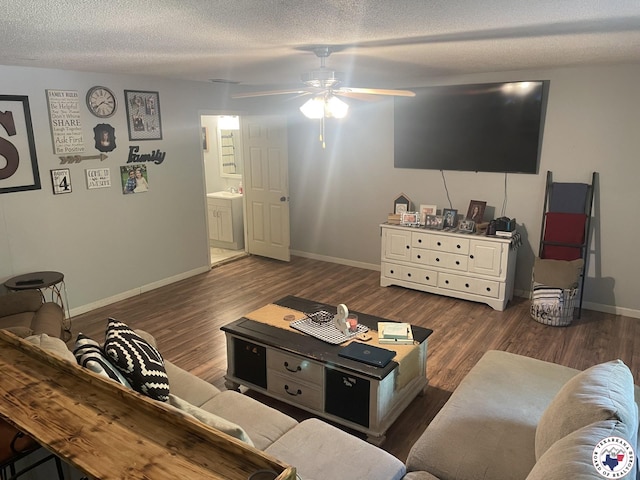 1921 E 40th St, Texarkana, AR 71854 - living room with ceiling fan, wood finished floors, and a textured ceiling