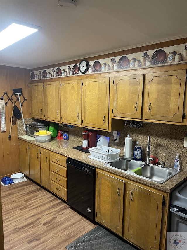 kitchen featuring sink, dishwasher, and light hardwood / wood-style flooring