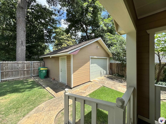 2504 Walnut St, Texarkana, TX 75503 - fenced backyard featuring a garage and an outbuilding
