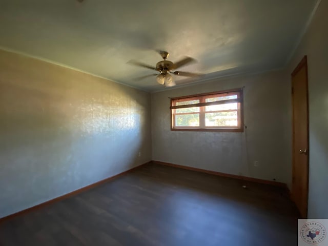 empty room with ceiling fan, wood-type flooring, and crown molding