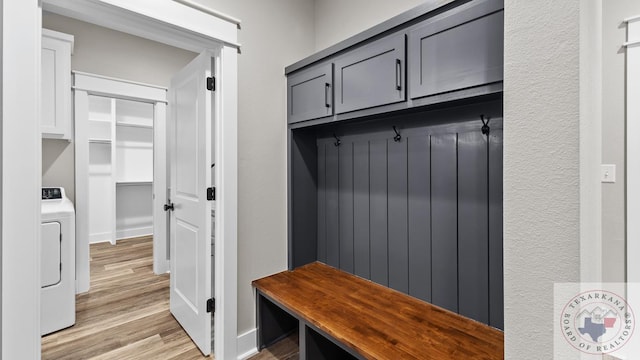 mudroom featuring washer / clothes dryer and light hardwood / wood-style flooring