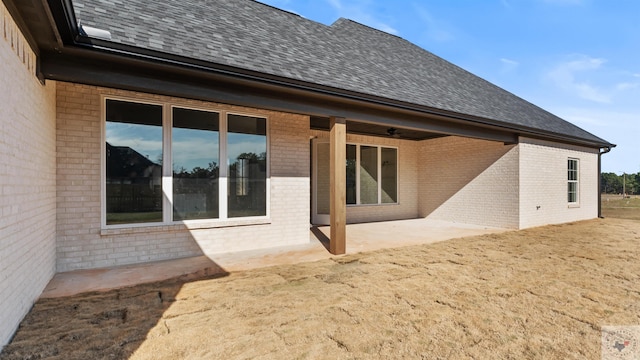 back of house with a patio