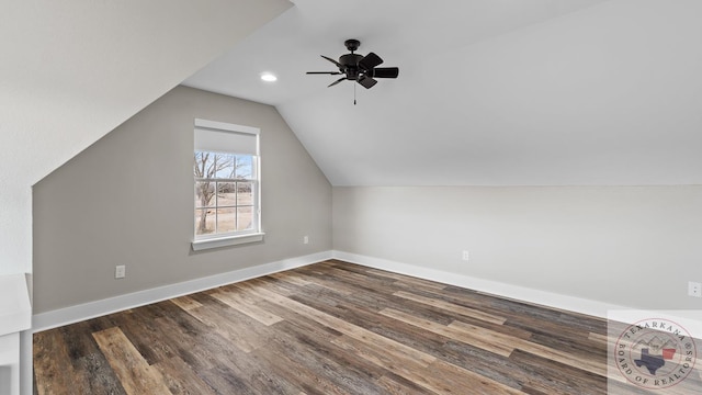 bonus room with vaulted ceiling, ceiling fan, and dark hardwood / wood-style flooring