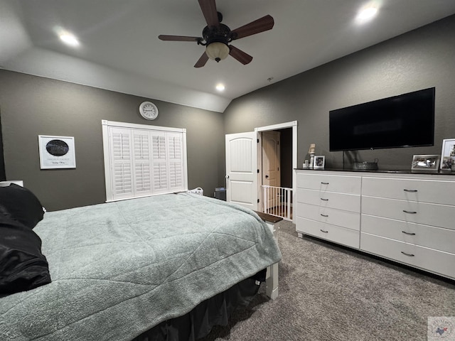 carpeted bedroom featuring ceiling fan and lofted ceiling