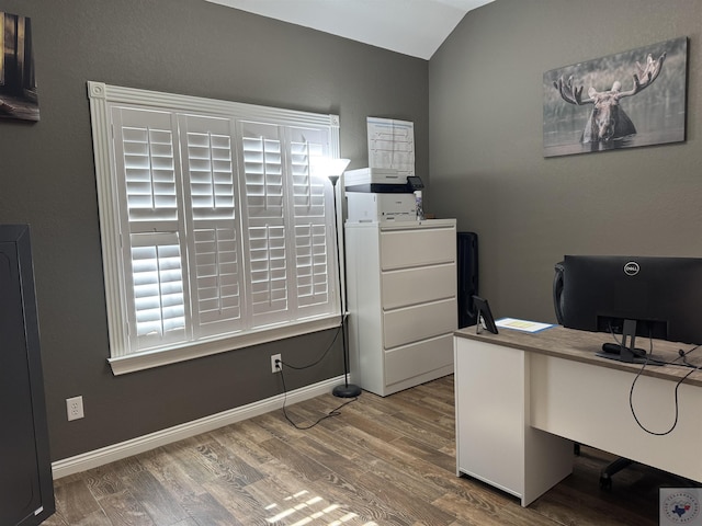 office area featuring hardwood / wood-style flooring and vaulted ceiling