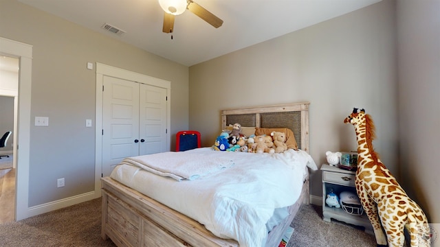 carpeted bedroom featuring a closet and ceiling fan