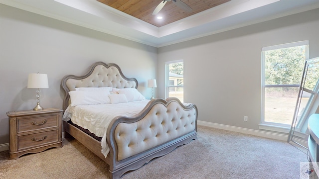 bedroom with light carpet, crown molding, ceiling fan, a raised ceiling, and wooden ceiling