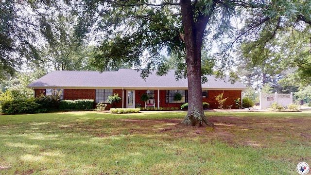 144 Joe Tyl Rd, Texarkana, TX 75501 - single story home with a front yard and brick siding
