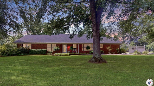 144 Joe Tyl Rd, Texarkana, TX 75501 - single story home with a front lawn and brick siding
