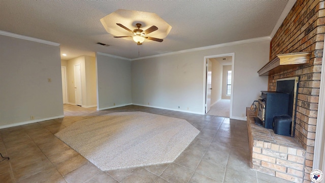 unfurnished living room featuring baseboards, a textured ceiling, crown molding, and ceiling fan