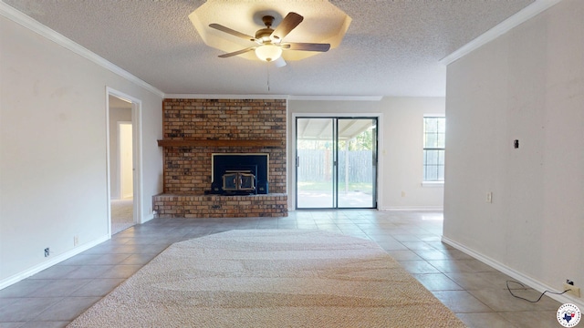 unfurnished living room featuring tile patterned floors, ceiling fan, crown molding, and a textured ceiling