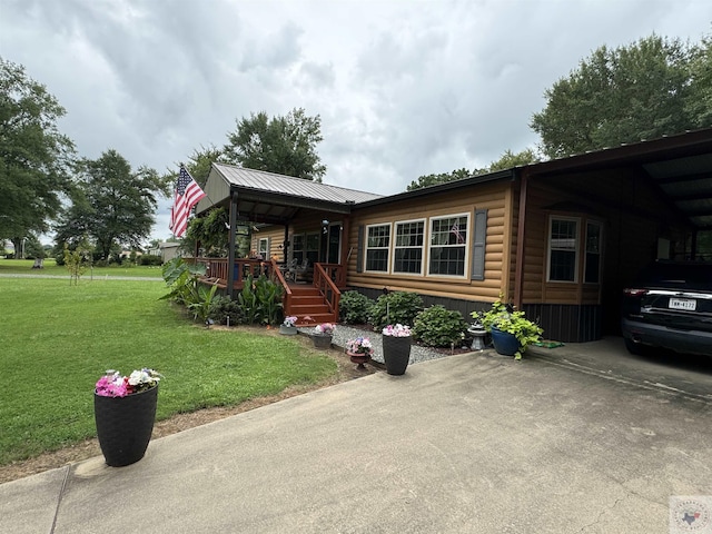 75 Westwood Ln, New Boston, TX 75570 - log home with a front lawn, a carport, and a porch