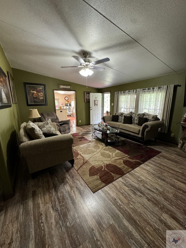 75 Westwood Ln, New Boston, TX 75570 - living room with ceiling fan, lofted ceiling, wood-type flooring, and a textured ceiling