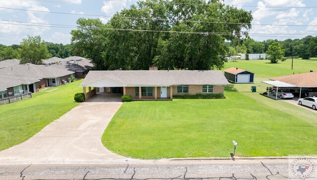 single story home featuring a front lawn