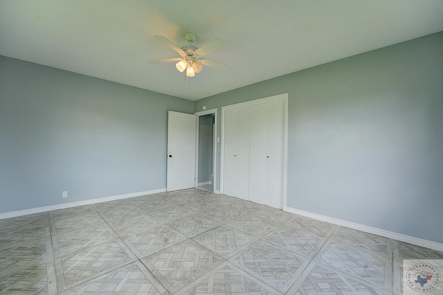 unfurnished bedroom featuring a closet and ceiling fan