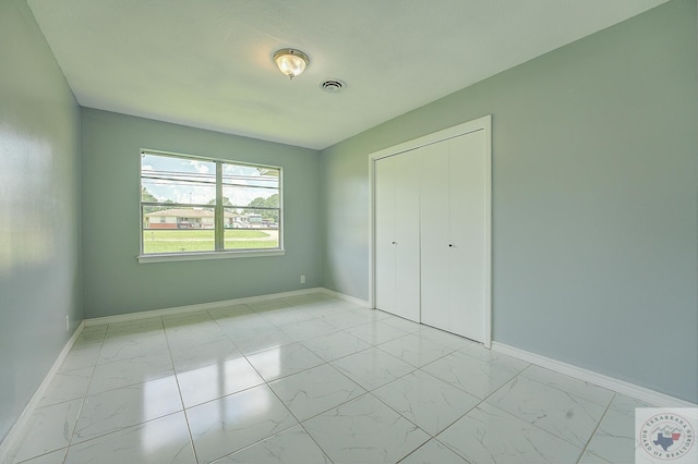 unfurnished bedroom featuring a closet