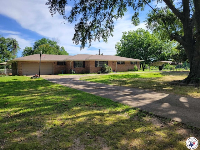 5105 Tennessee Rd, Texarkana, AR 71854 - ranch-style home with an attached garage, brick siding, driveway, and a detached carport
