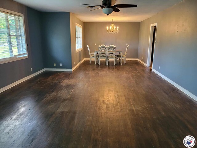 5105 Tennessee Rd, Texarkana, AR 71854 - unfurnished dining area featuring plenty of natural light, a chandelier, and dark wood-type flooring