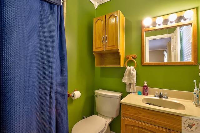 bathroom with toilet and vanity