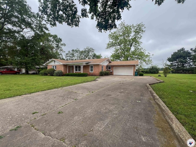 ranch-style house featuring an attached garage, brick siding, a front yard, and concrete driveway