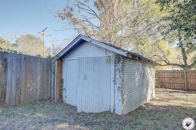 view of shed featuring a fenced backyard