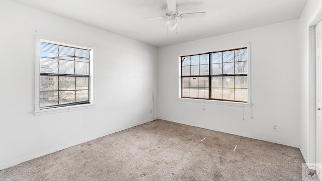unfurnished room featuring baseboards, a ceiling fan, and carpet flooring