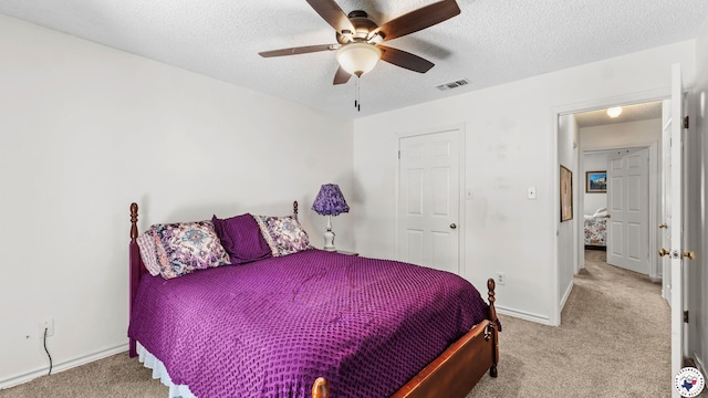 201 Larkspur Ln, Wake Village, TX 75501 - carpeted bedroom featuring a textured ceiling and ceiling fan