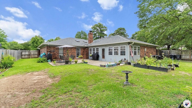 201 Larkspur Ln, Wake Village, TX 75501 - back of property with a patio area, a garden, a chimney, brick siding, and a fenced backyard