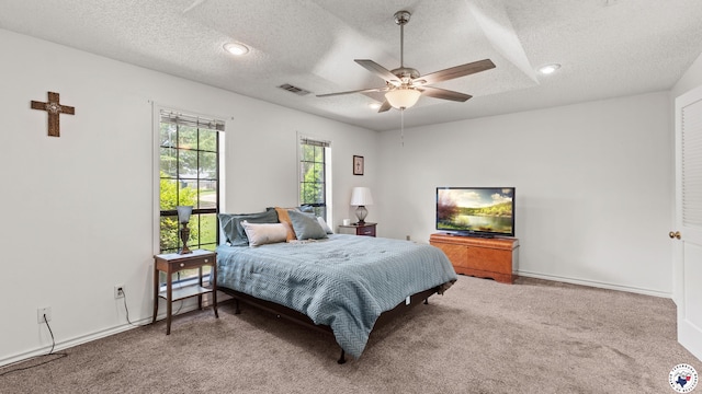 201 Larkspur Ln, Wake Village, TX 75501 - carpeted bedroom with a textured ceiling and ceiling fan