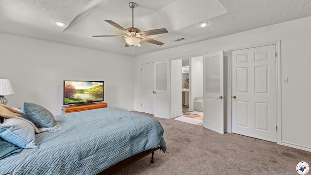 201 Larkspur Ln, Wake Village, TX 75501 - carpeted bedroom with a textured ceiling, connected bathroom, recessed lighting, and a ceiling fan