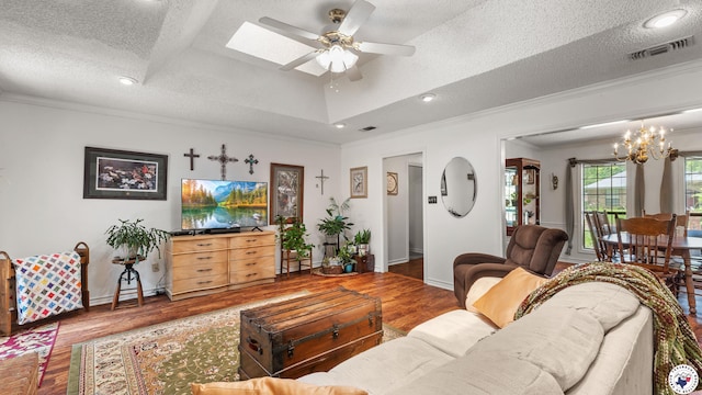 201 Larkspur Ln, Wake Village, TX 75501 - living area with crown molding, wood finished floors, a ceiling fan, a chandelier, and a textured ceiling
