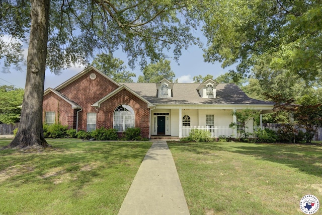 6903 Cherrybark Cir, Texarkana, AR 71854 - view of front of home featuring covered porch, brick siding, and a shingled roof