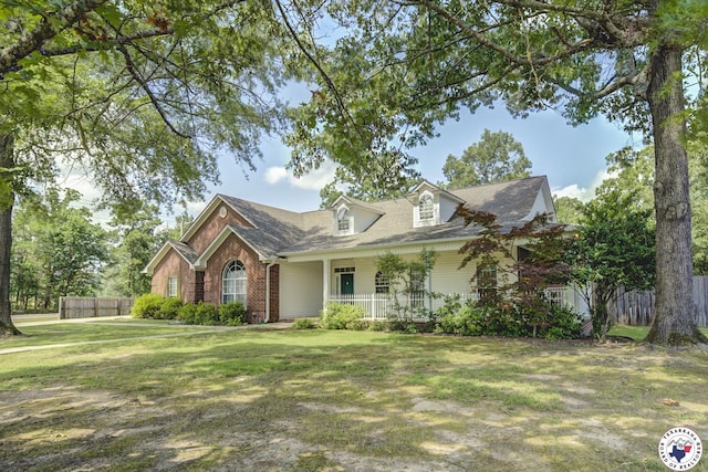6903 Cherrybark Cir, Texarkana, AR 71854 - view of front facade with brick siding and a porch