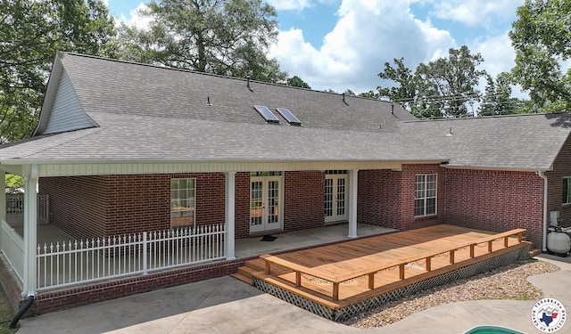 6903 Cherrybark Cir, Texarkana, AR 71854 - back of house featuring french doors, roof with shingles, brick siding, a patio, and a deck