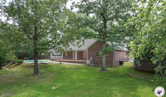 6903 Cherrybark Cir, Texarkana, AR 71854 - view of front facade with brick siding and a wooden deck