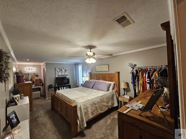 bedroom featuring dark carpet, a textured ceiling, ceiling fan, and ornamental molding