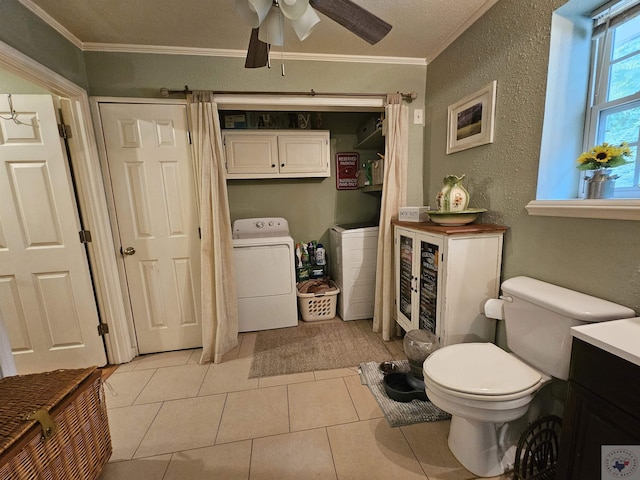 bathroom featuring washer and clothes dryer, tile patterned floors, vanity, ornamental molding, and ceiling fan