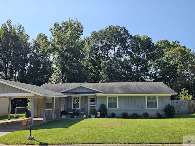 single story home with a front lawn and a carport