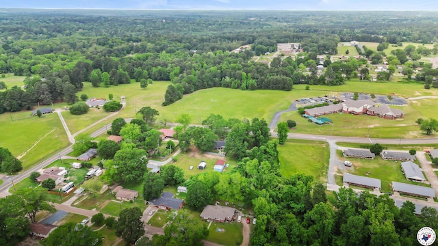 drone / aerial view with a residential view and a wooded view