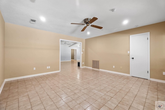 empty room with light tile patterned flooring and ceiling fan