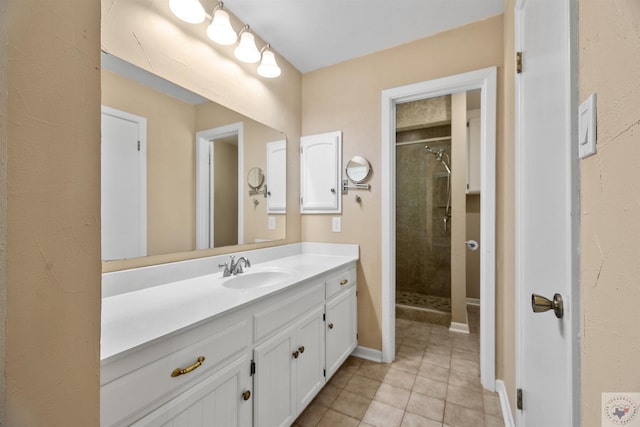 bathroom featuring vanity, a shower with door, and tile patterned flooring