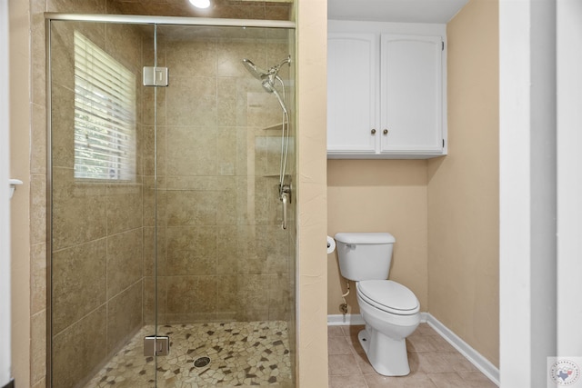 bathroom with toilet, an enclosed shower, and tile patterned flooring