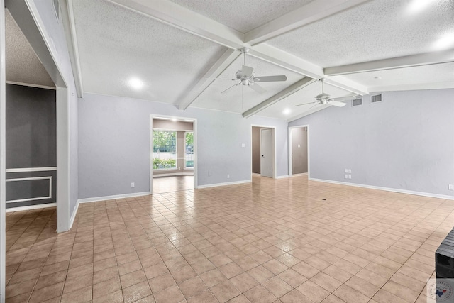 unfurnished living room with ceiling fan, a textured ceiling, light tile patterned floors, and lofted ceiling with beams