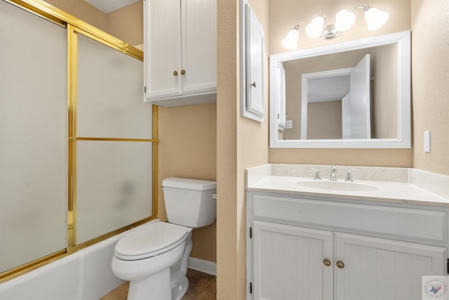 full bathroom featuring vanity, toilet, and combined bath / shower with glass door