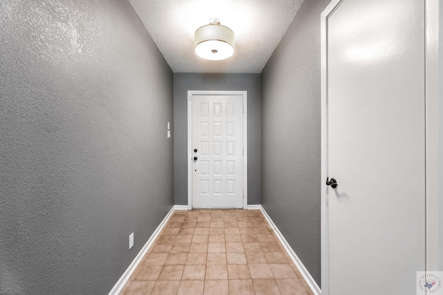 entryway featuring a textured ceiling