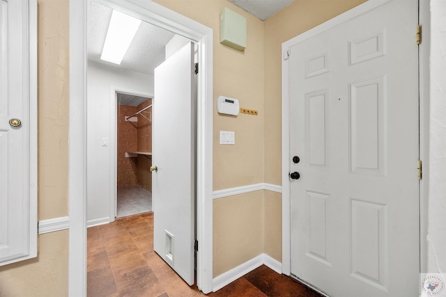 interior space featuring a textured ceiling